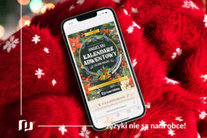 telefon na tle czerwonego koca świątecznego z wyświetlona okładka ebooka Angielski kalendarz adwentowy od Preston Publishing